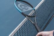 Tennis racquet above net