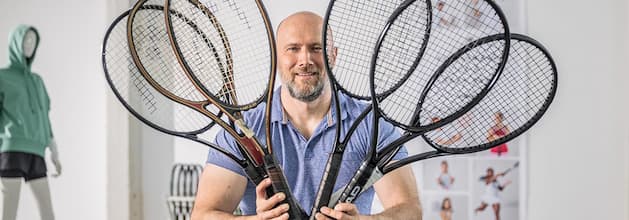 Man holding few racquets