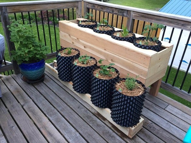 self-watering planters in garden