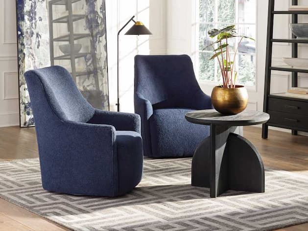 blue replica accent chairs in a living room