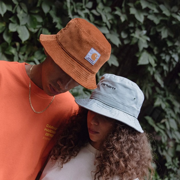 two young people wearing different coloured Carhartt WIP bucket hats