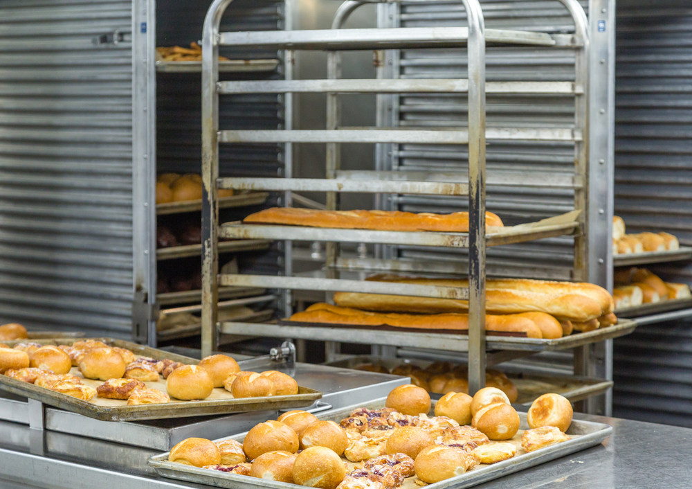 baked bread on racks and pans