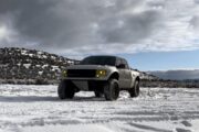 a ford in a offroad terrain with variety of ecoboost performance parts installed