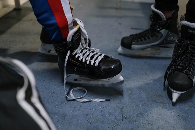 player wearing Bauer hockey skates