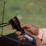person holding a flashlight