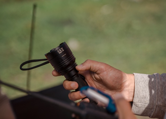 person holding a flashlight