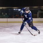 hockey player with Sherwood stick
